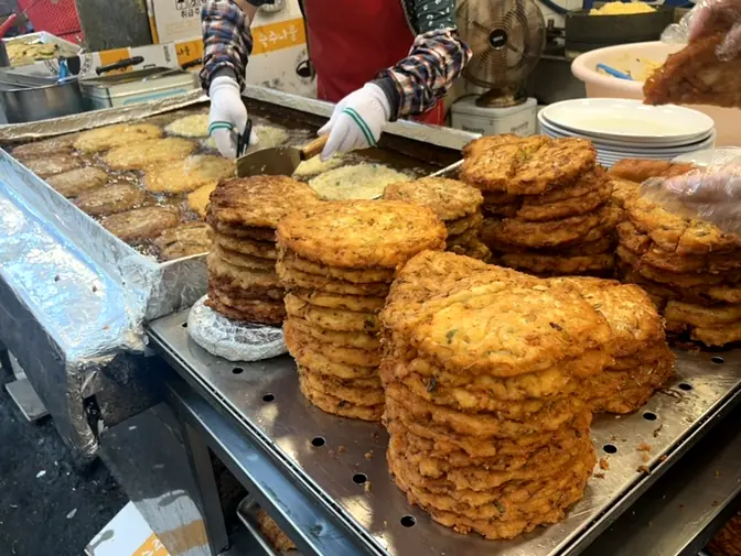 Stacks of freshly fried bindaetteok