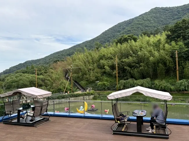 Rooftop terrace swing seats with mountain views