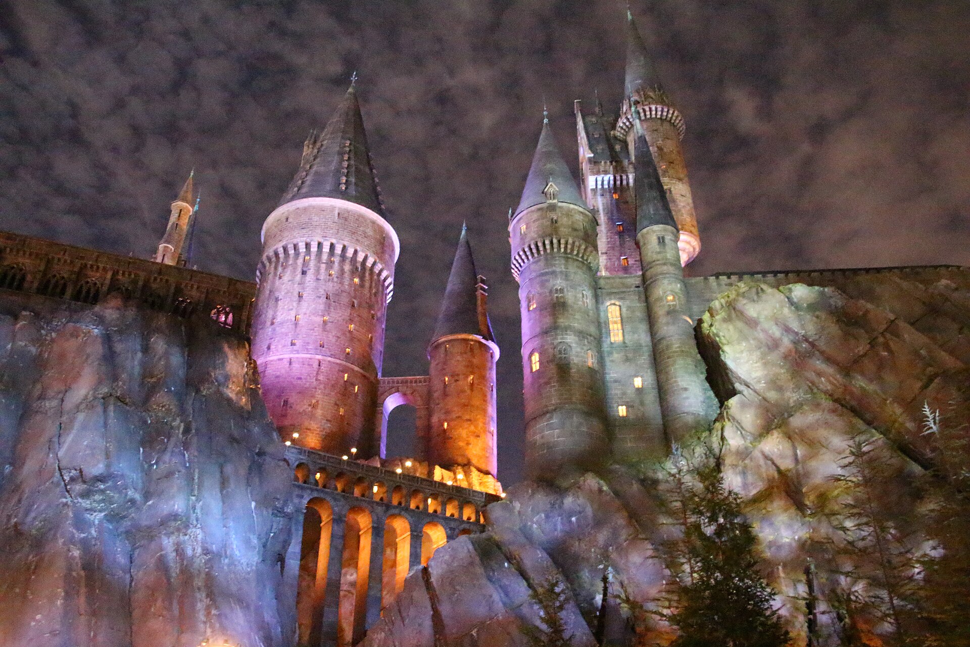 Hogwarts Castle lit up at night in The Wizarding World of Harry Potter at Universal's Islands of Adventure.