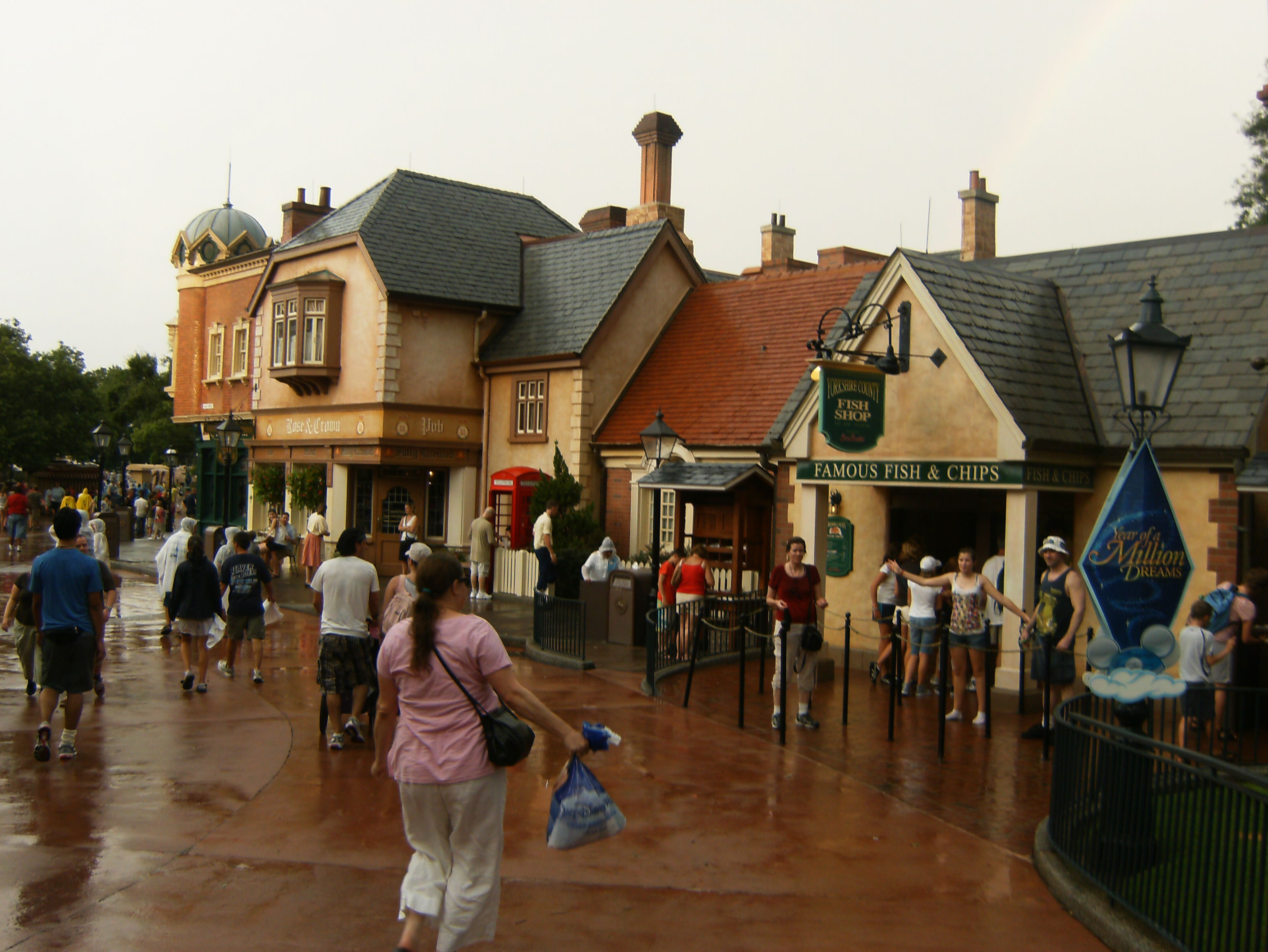 A street in EPCOT's United Kingdom pavilion with the Rose & Crown Pub and the Yorkshire County Fish Shop.