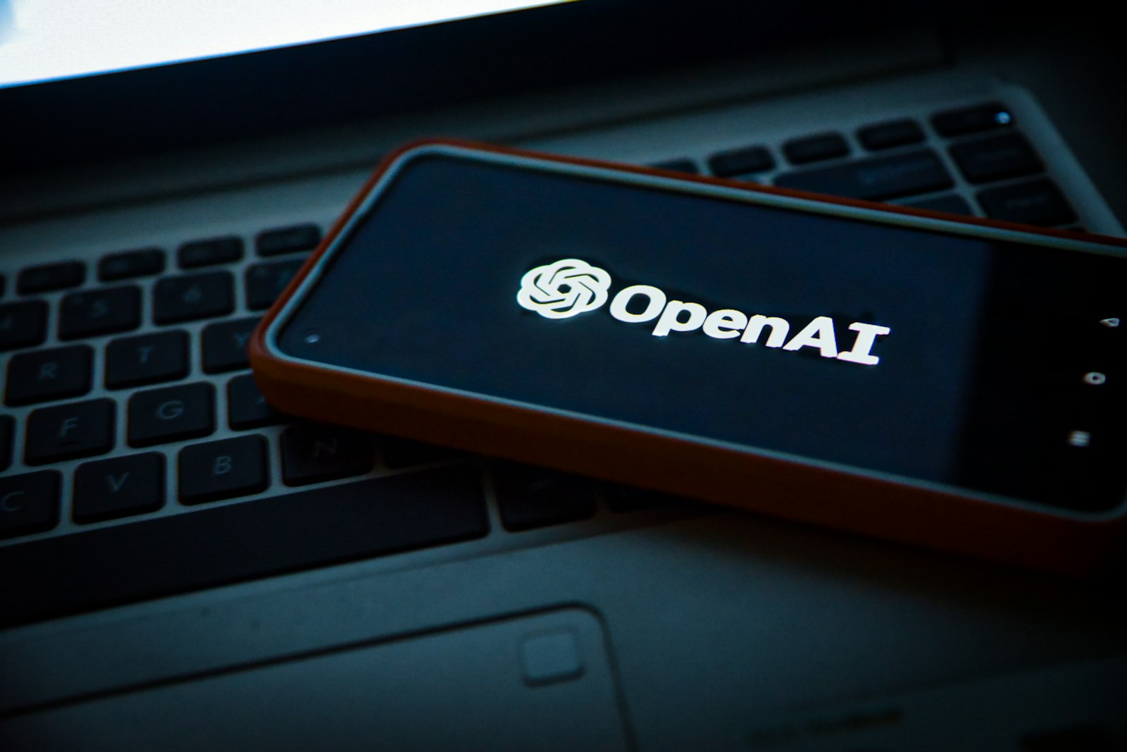 OpenAI logo on a phone screen