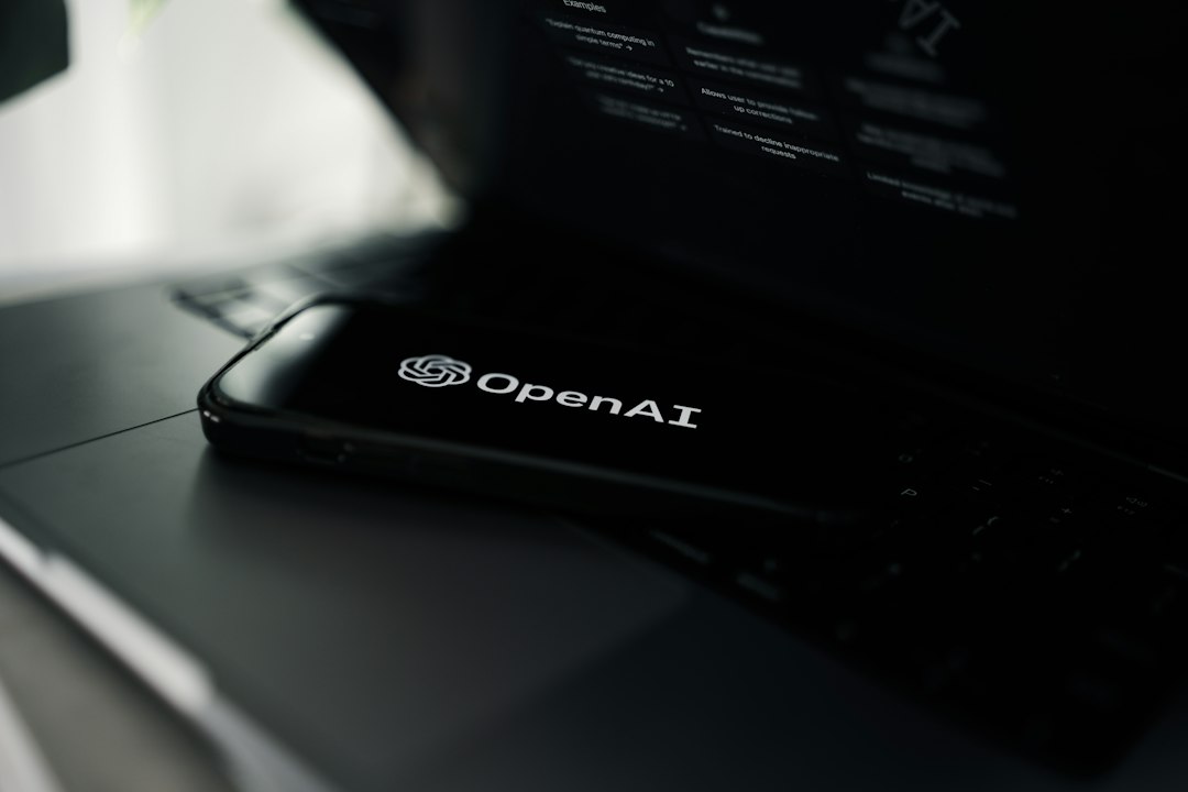 Close-up of a laptop showing ChatGPT and OpenAI