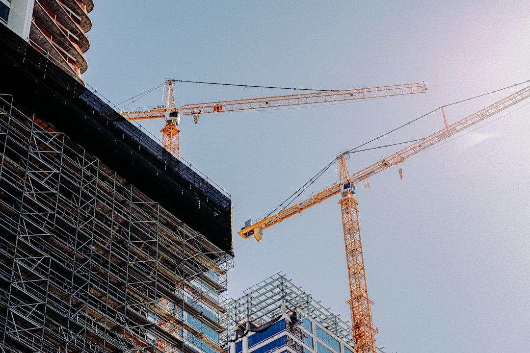 Tower cranes over a large building under construction