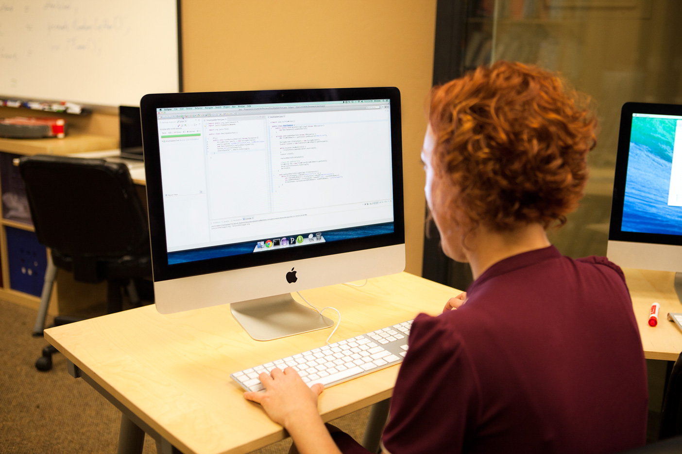 A programmer writing code with unit tests