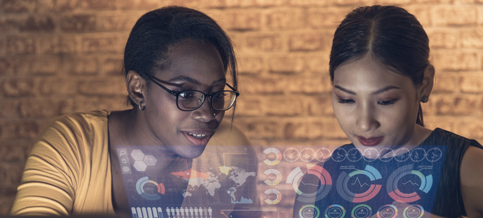 Two data scientists working on a dashboard.