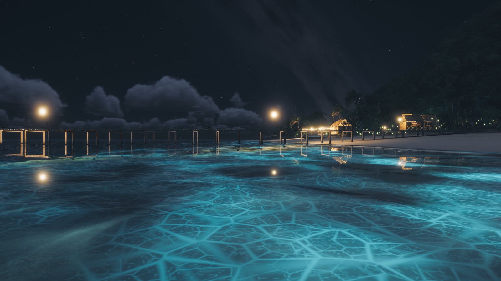 Night on the beach, the surf glowing blue, lanterns along the pier