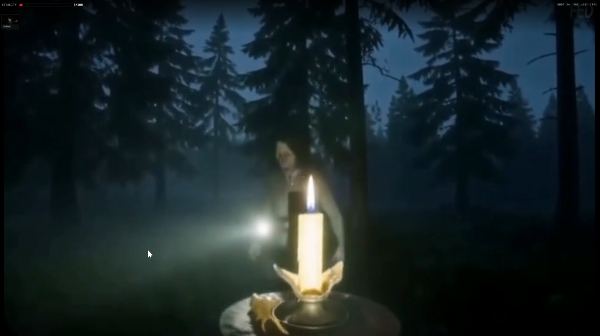 Shot 26 of THE LOST TAPE: a pale figure standing behind a candle in the misty night woods