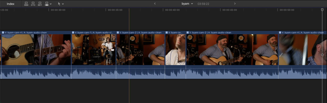 A video-studio multicam cut on the Final Cut Pro timeline, switching camera angles over the shared master audio