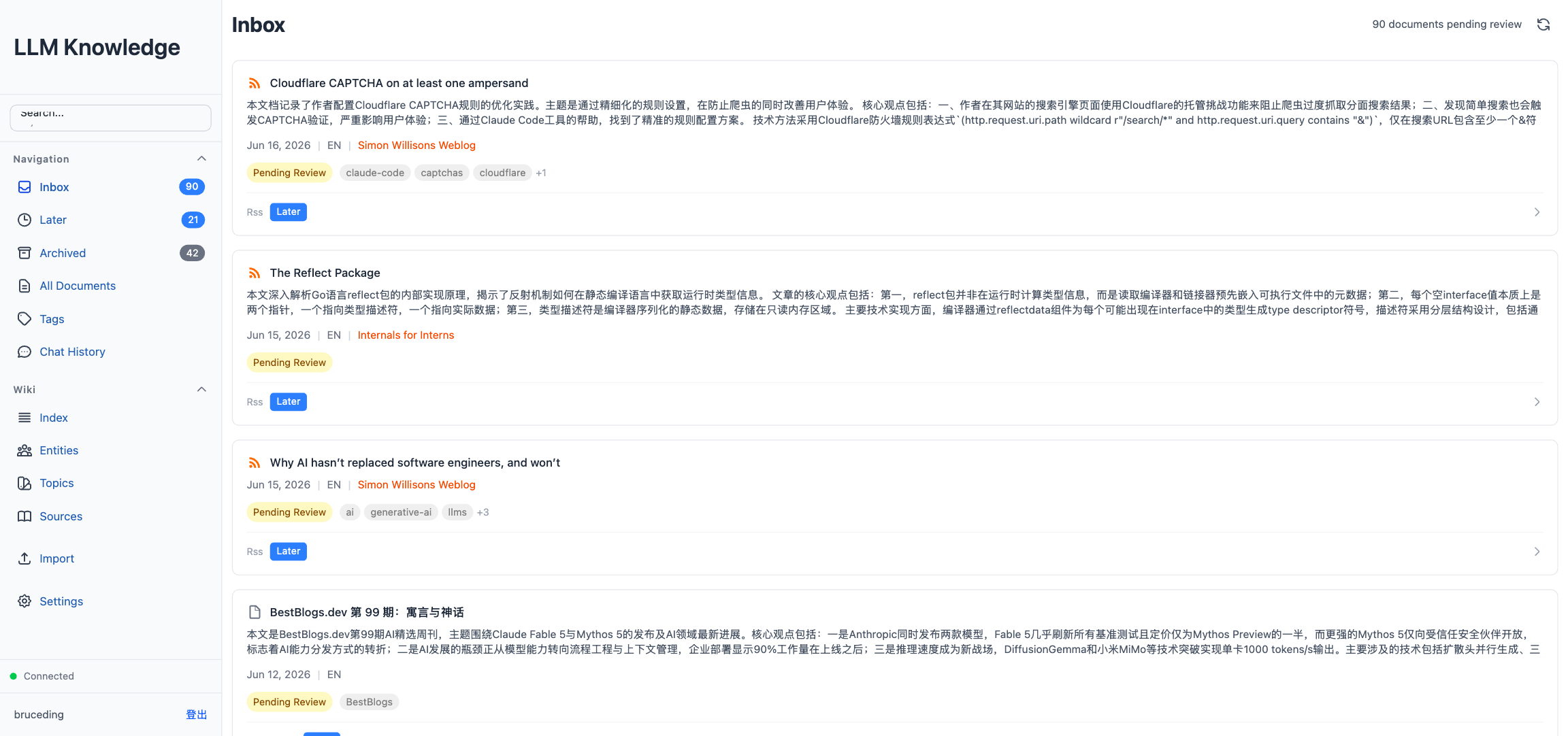 Inbox view: each document card carries an LLM-generated summary, tags, language badge, and status.