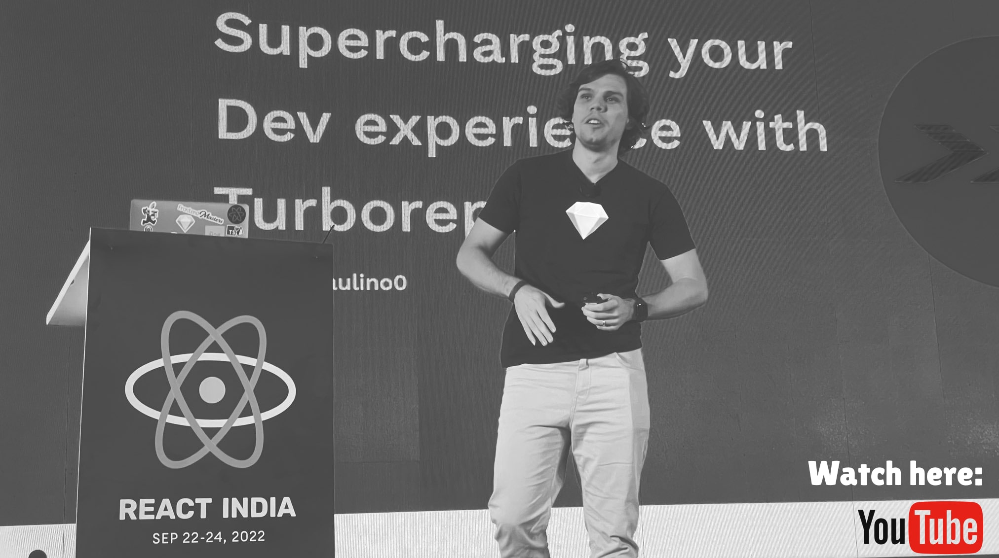 Bruno on stage giving the turborepo talk with the slides in the background