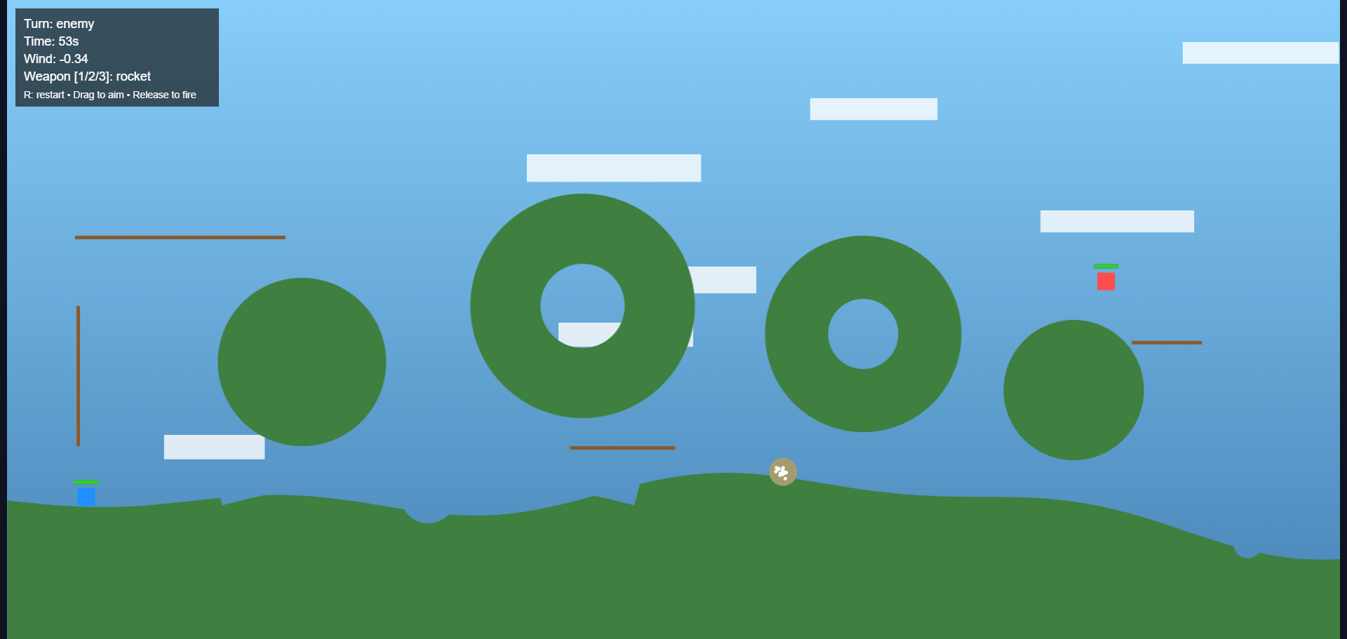 Wild Ones browser game showing character, terrain collision detection, and physics-based weapon mechanics