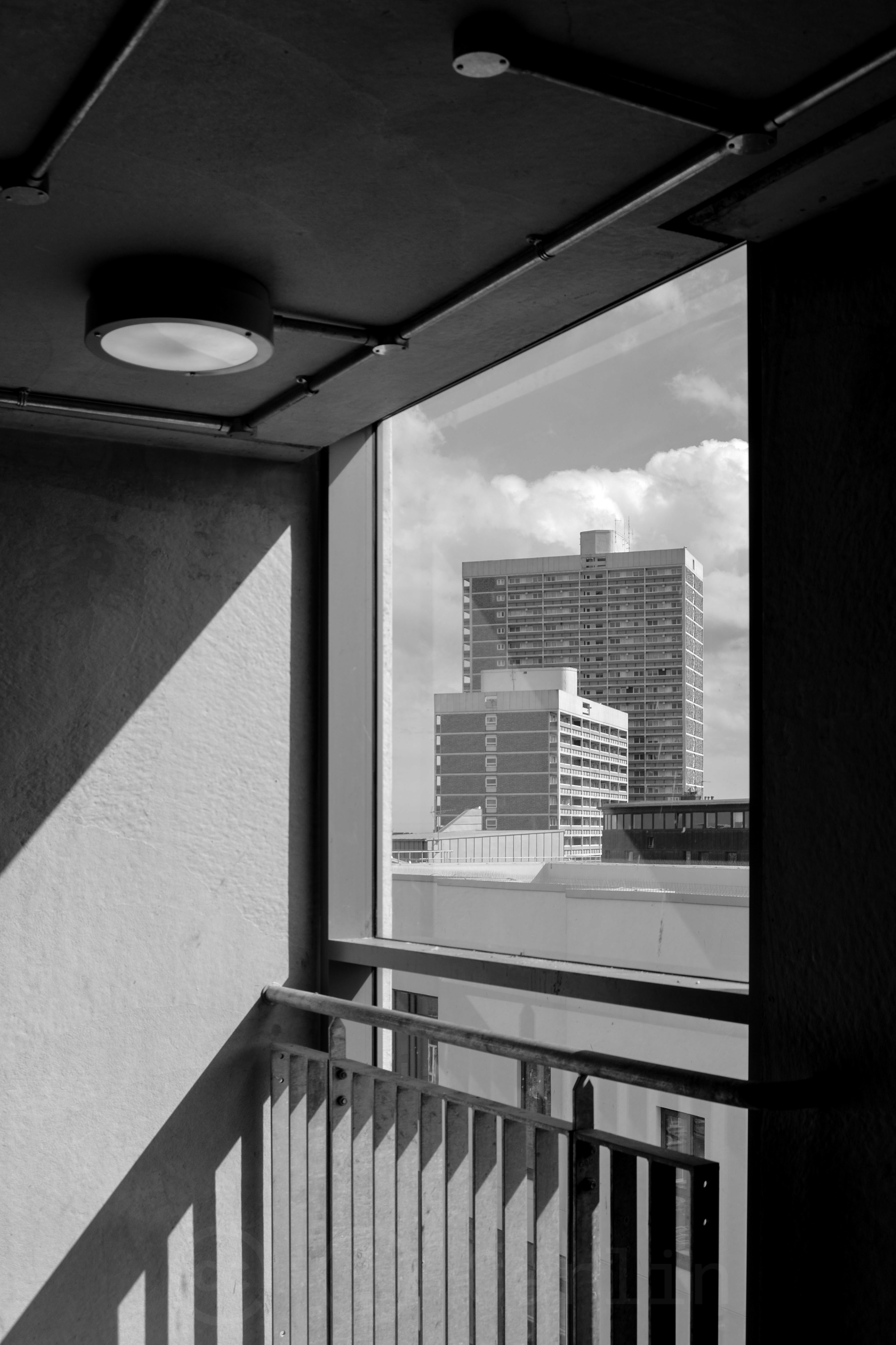 A high rise building framed in a window