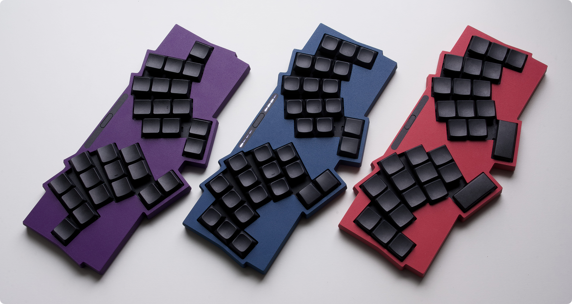Comparison of Visorbearer keyboard in single pinkie, standard 32-key, and 2x 2U thumb layouts