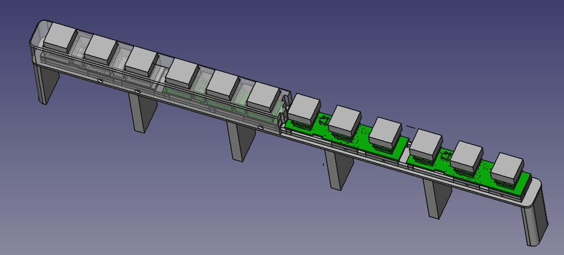 Screenshot of the thing in FreeCAD. Half of the front shell is missing and the other half is half-translucent.