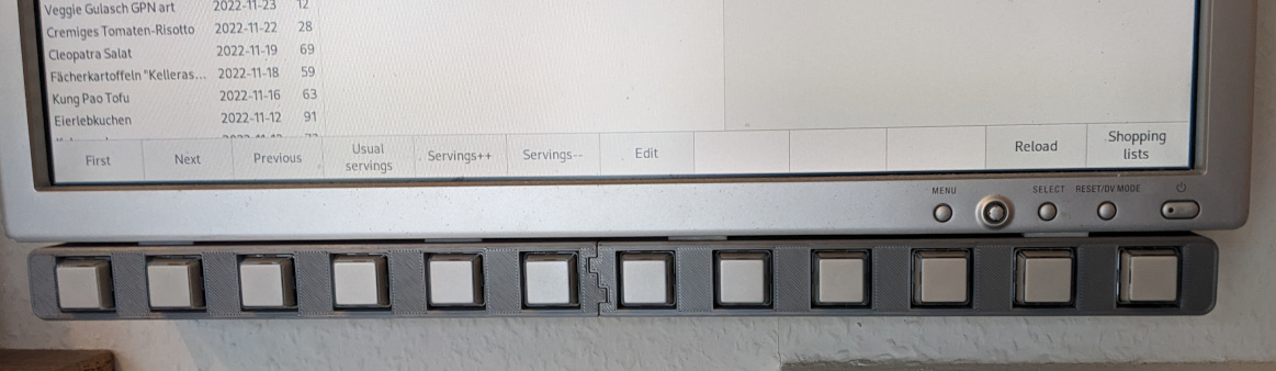 Photo of a 12-key softkey keypad below a 19" LCD monitor.