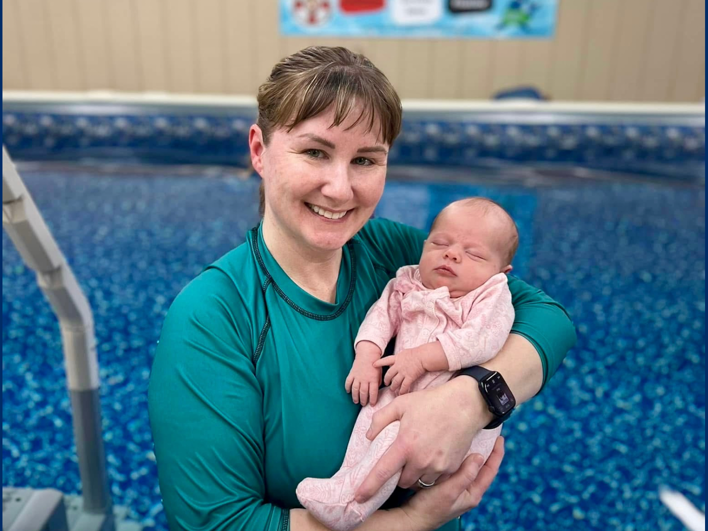 Daphne guiding a baby through an ISR survival swim lesson