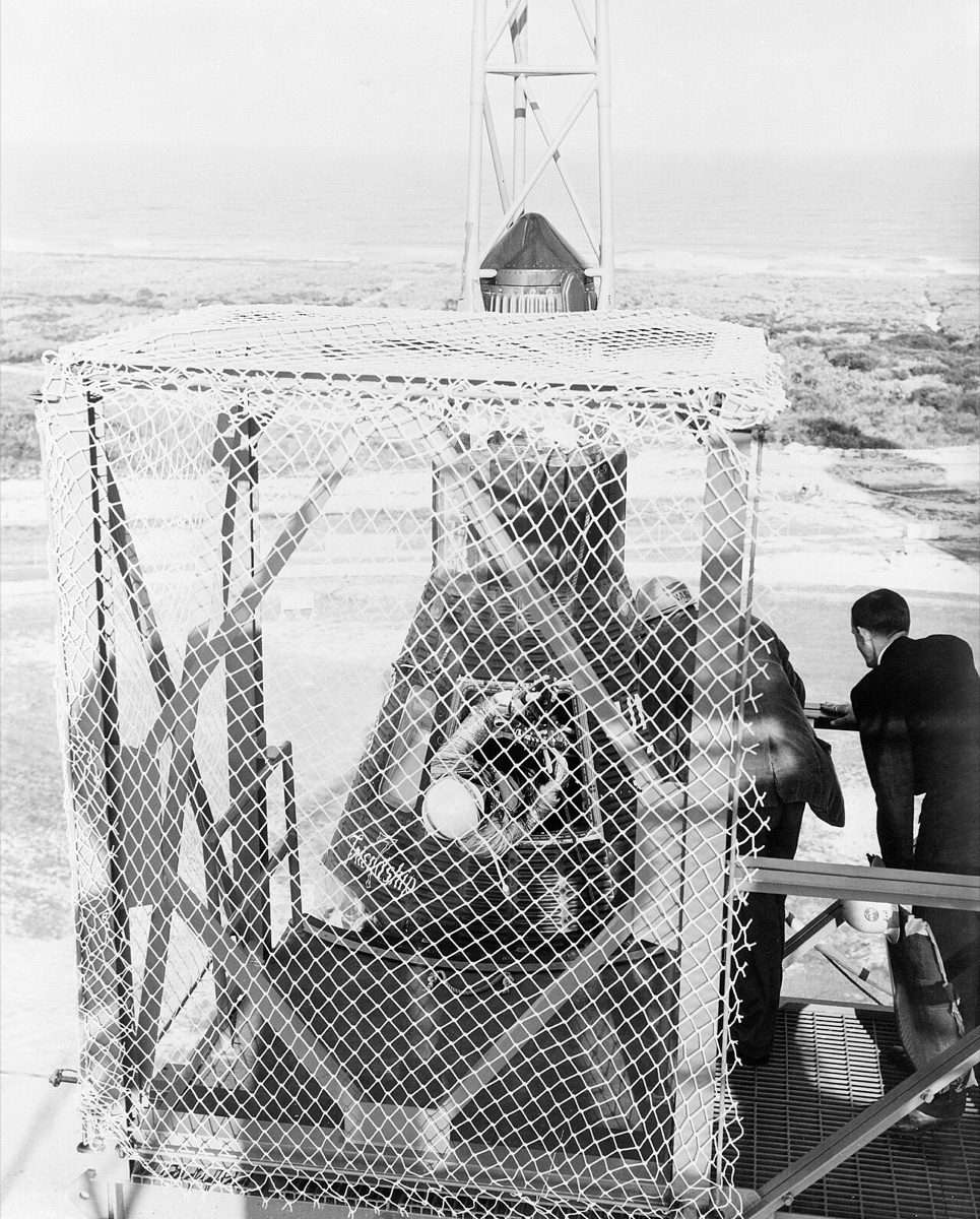 John Glenn beside the Friendship 7 capsule at Cape Canaveral before his orbital flight