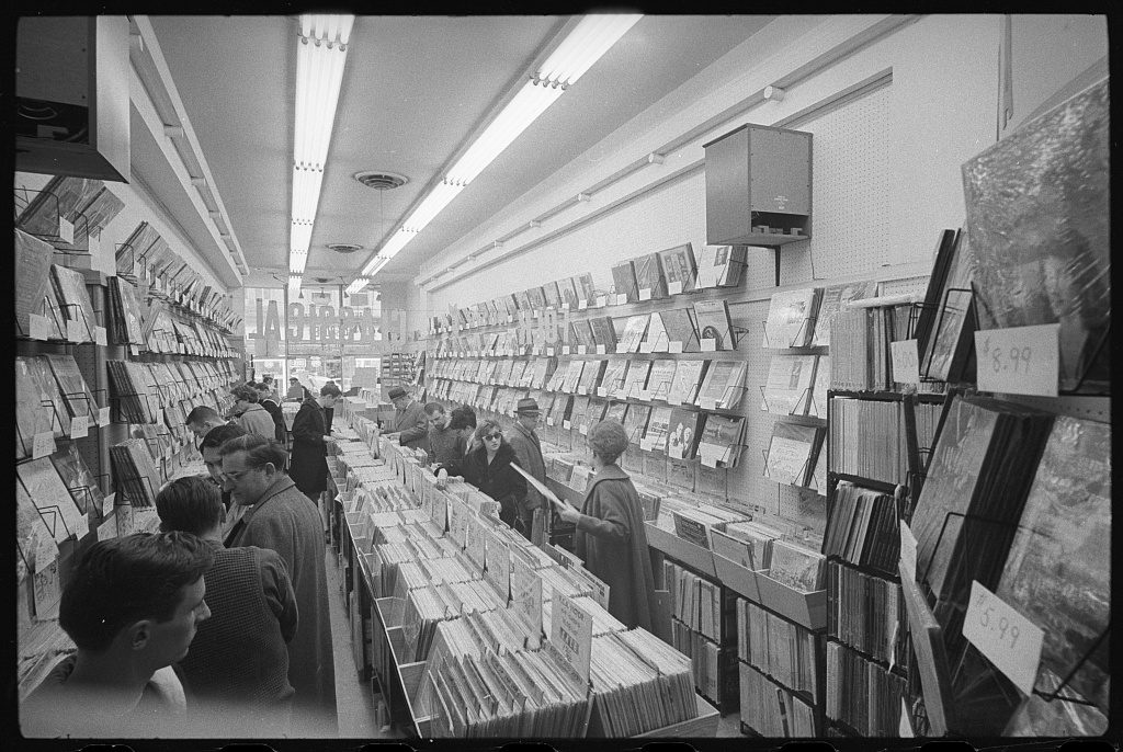 Customers going through the bins in an American record shop, photographed in 1963