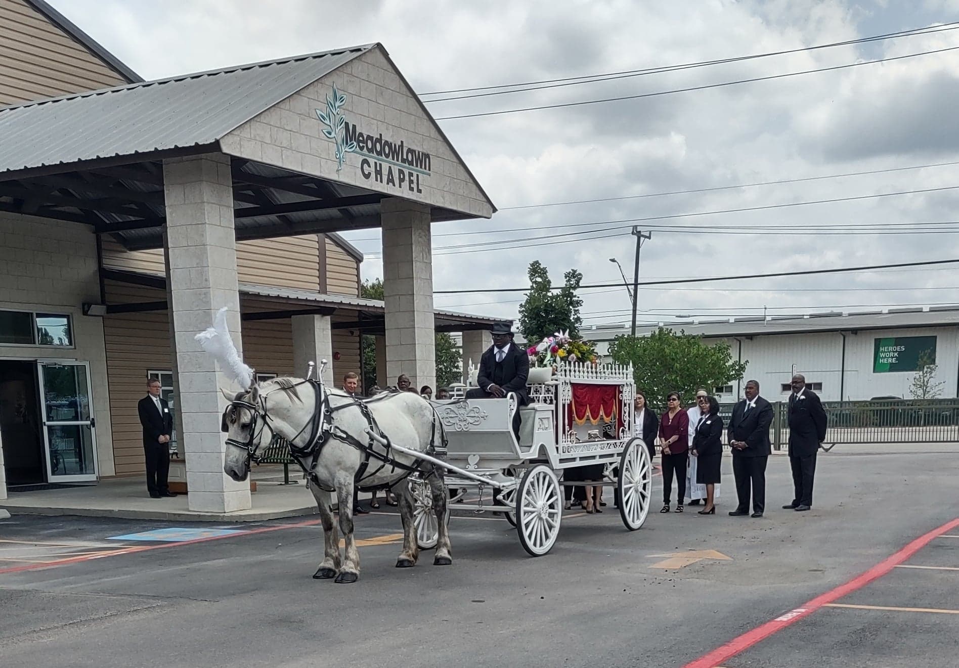 Horse-drawn hearse with funeral directors Texas Funeral Carriage
