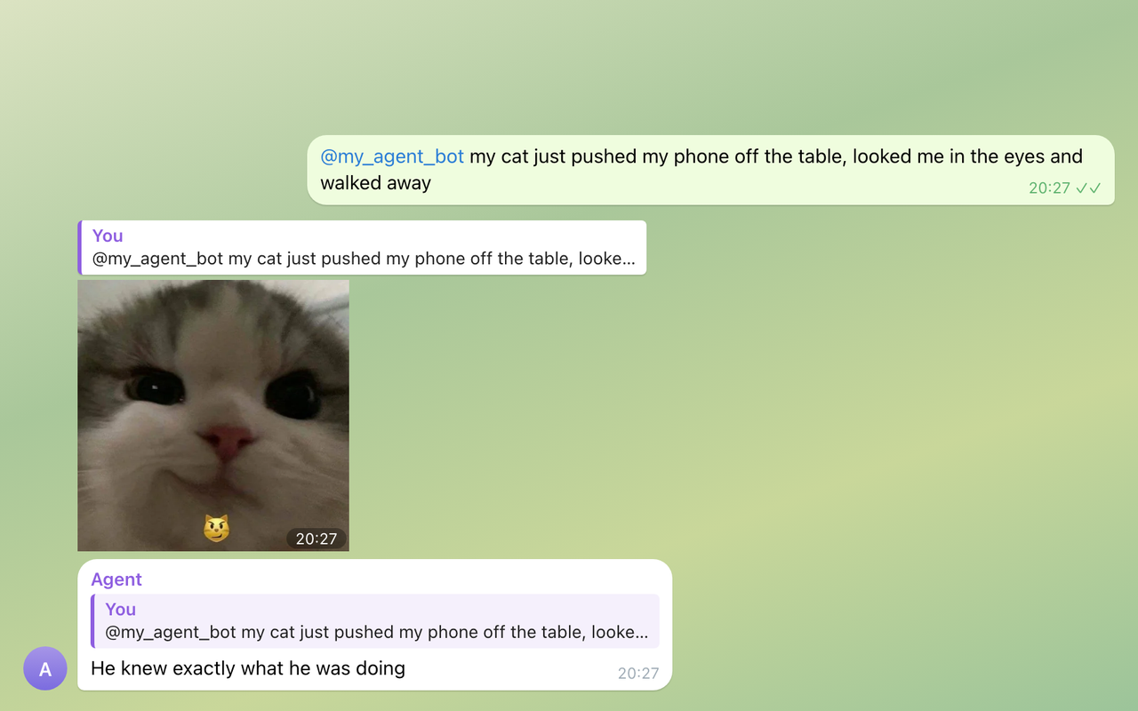Someone's cat pushed their phone off the table and walked away; the agent replies with a smug kitten sticker and one line.
