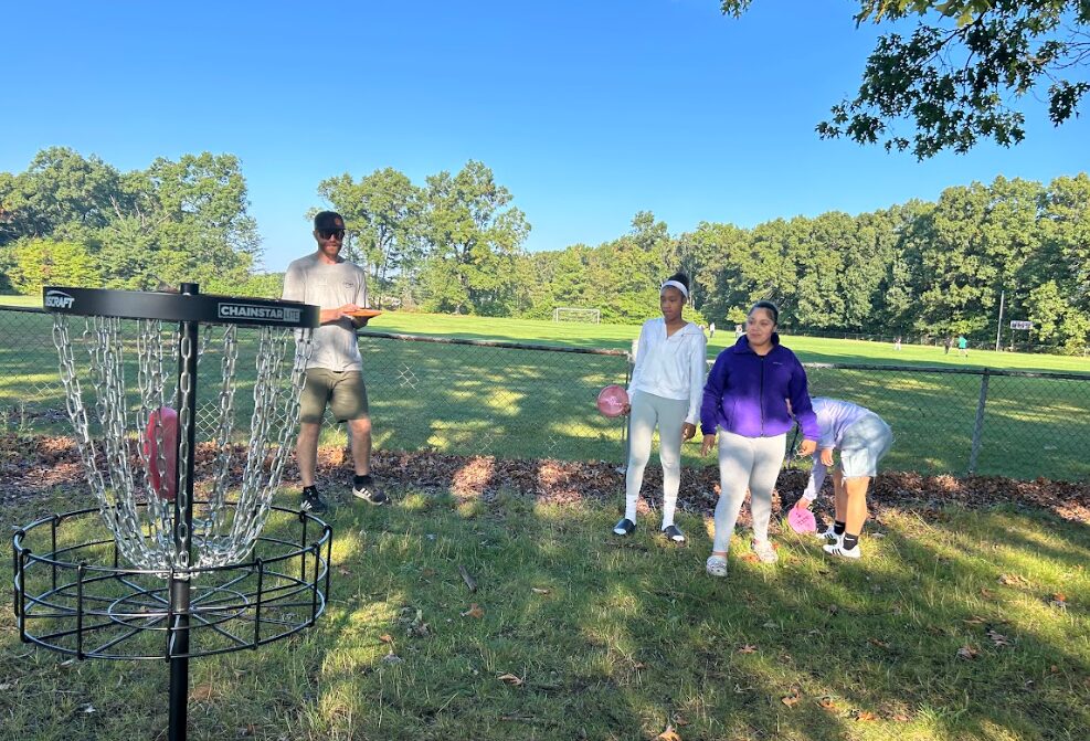 Third Coast students designing and testing a disc golf course on school grounds