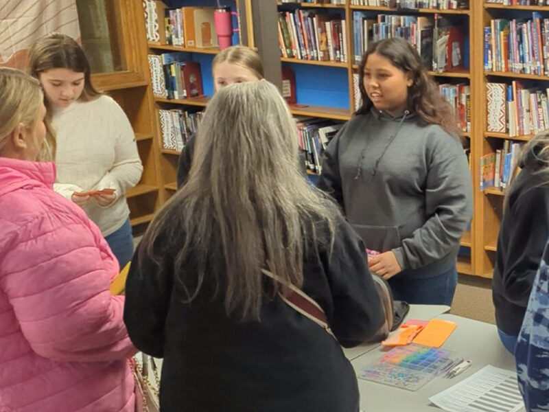 Students running their own businesses in a classroom mini-society market