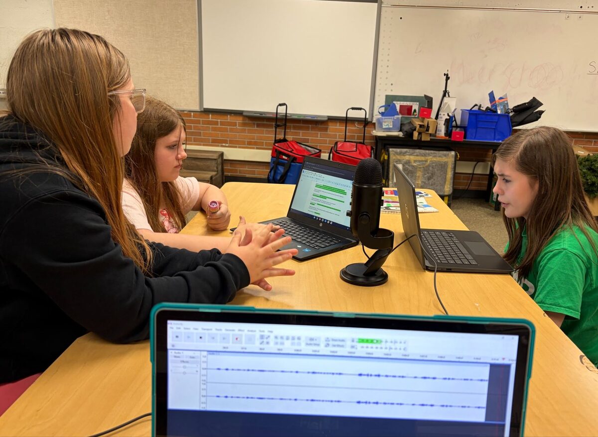 Students recording an original podcast connecting WWII history to refugee voices today