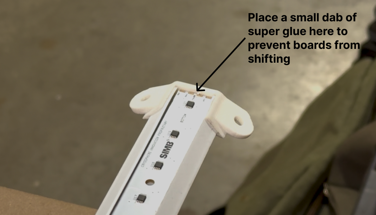 Bottom PCB seated against housing end