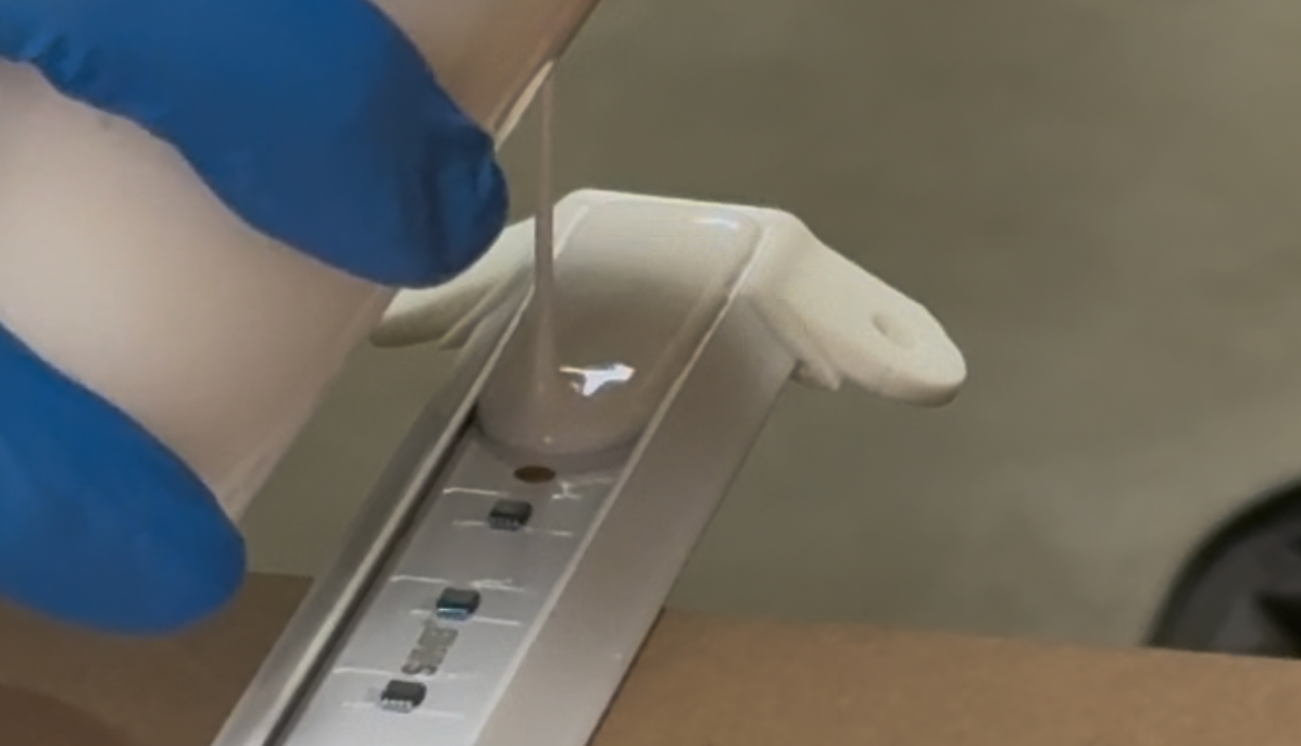 Pouring epoxy along a string