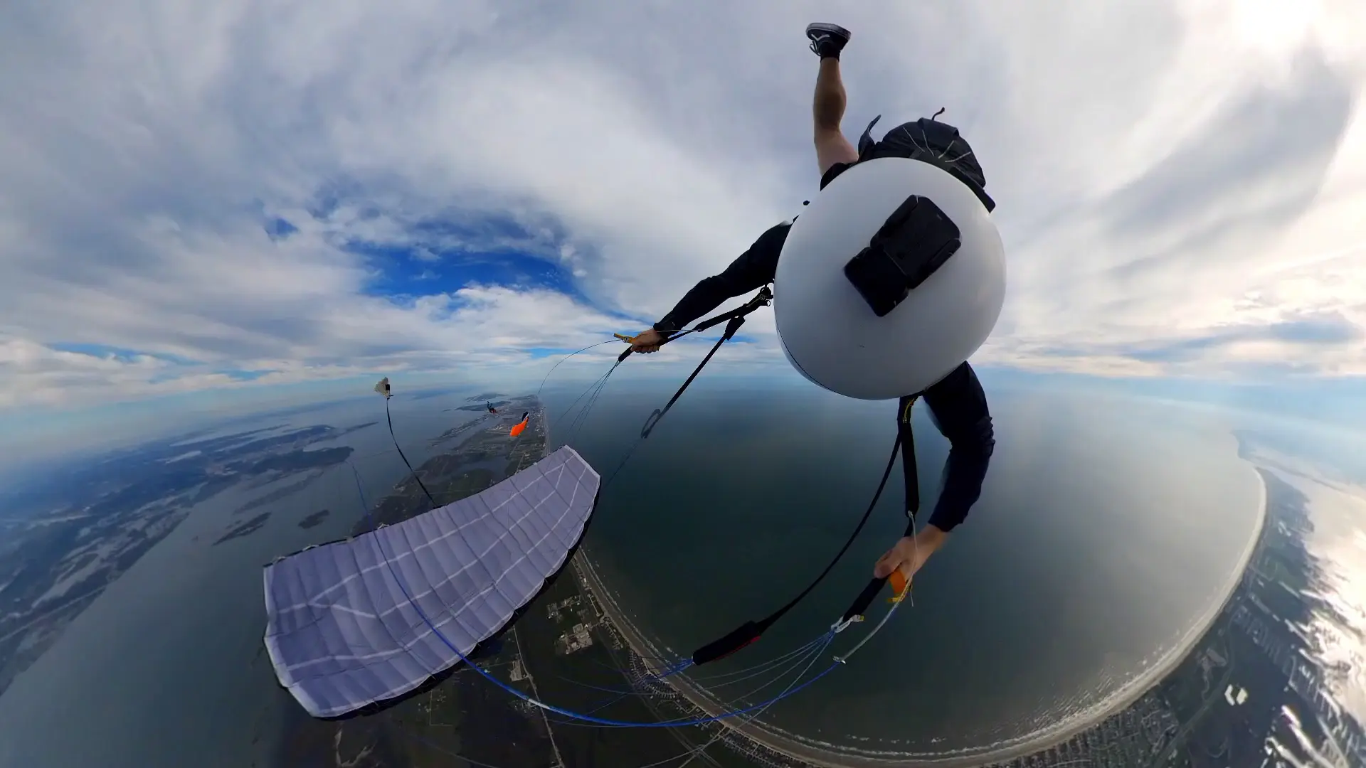 Vertical barrel rolls over the ocean.