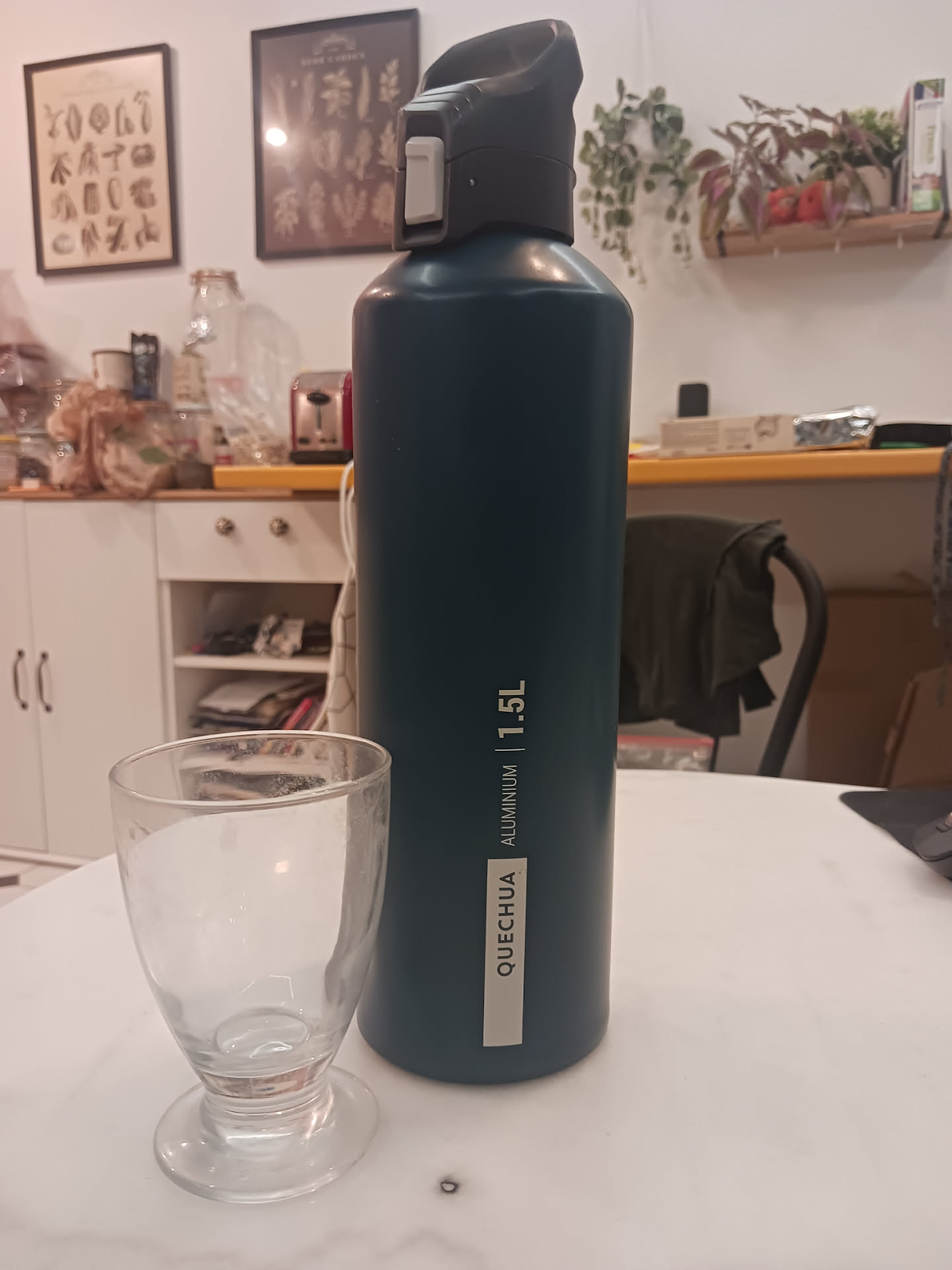 A picture of my new bottle next to my small glasses.