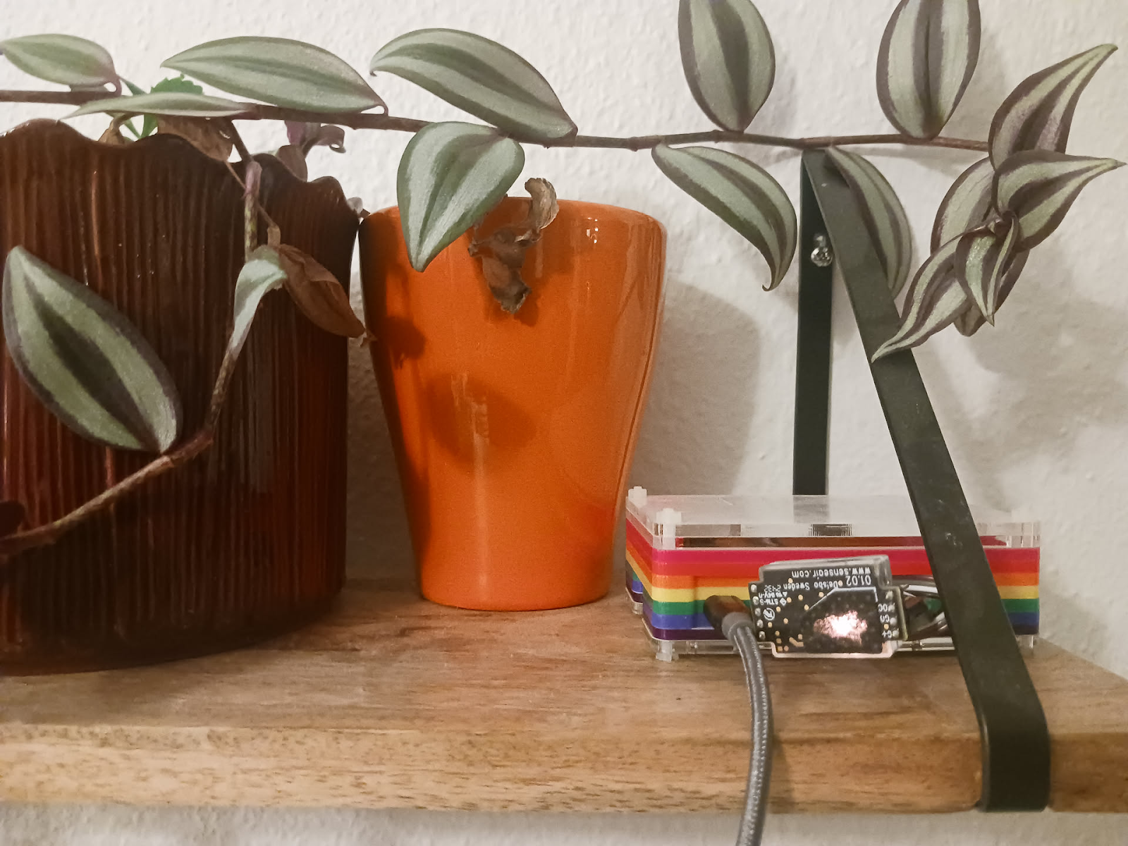 My old Raspberry Pi in a rainbow case with the Sensair S8 attached.