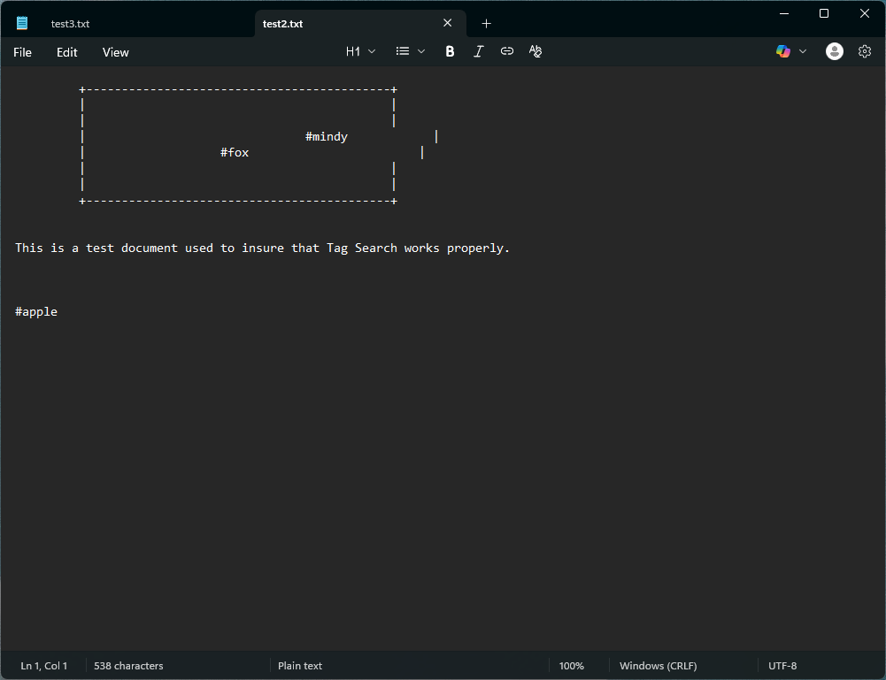 Screenshot of a .txt document that contains a table with hashtags placed inside. As you can see the hashtags "mindy" and "fox" are inside the box and the hashtag "apple" is outside of the box. The box can extend past it's original width.