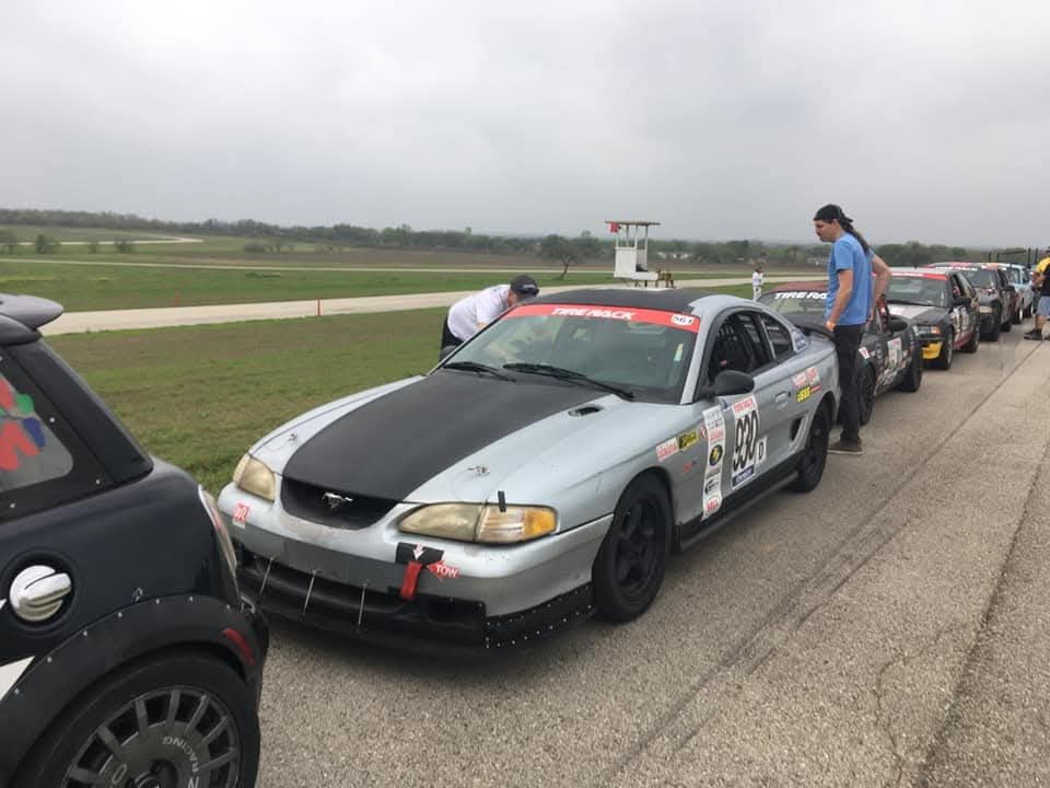 Silent Racing SN95 Ford Mustang lined up trackside with other cars