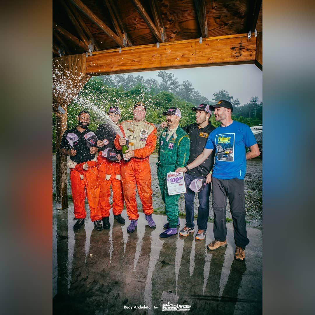 Matt Connolly Motorsports team celebrating with champagne after a race