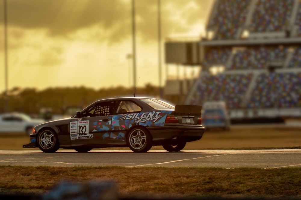 Silent Racing BMW E36 on track at Daytona International Speedway at sunset