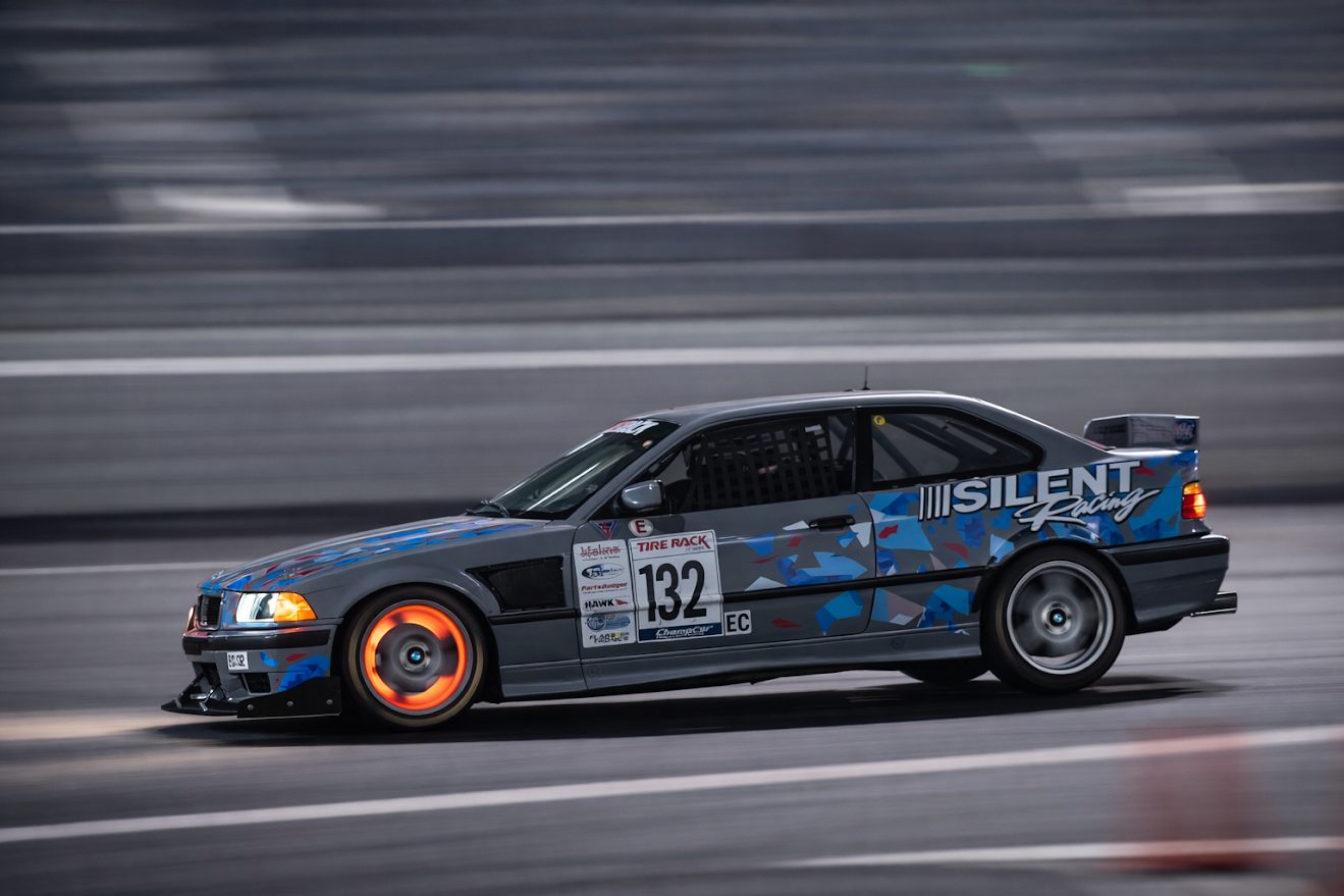 Silent Racing BMW E36 on track, side profile view