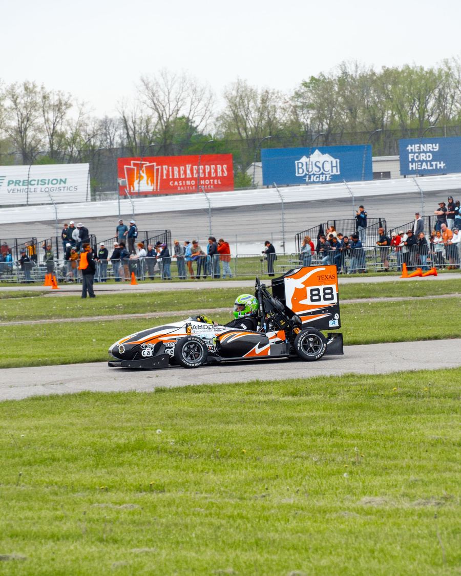 Longhorn Racing Formula SAE car #88 on track with spectators watching