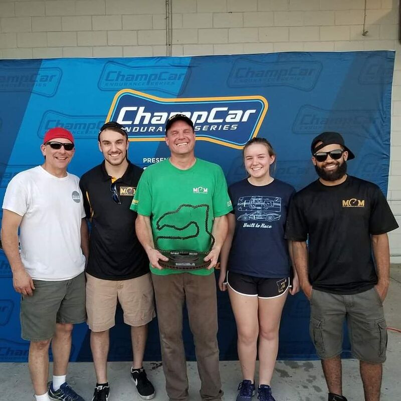 Matt Connolly Motorsports team celebrating a ChampCar Endurance Series podium finish