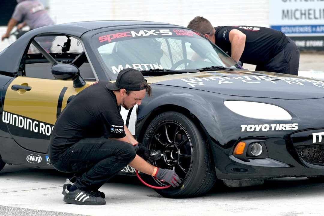 Servicing tires on the Winding Road Racing Spec MX-5 car