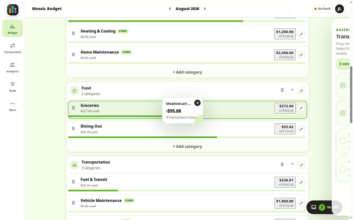 Several selected transaction bubbles being dragged together into the Groceries category in Mosaic Budget