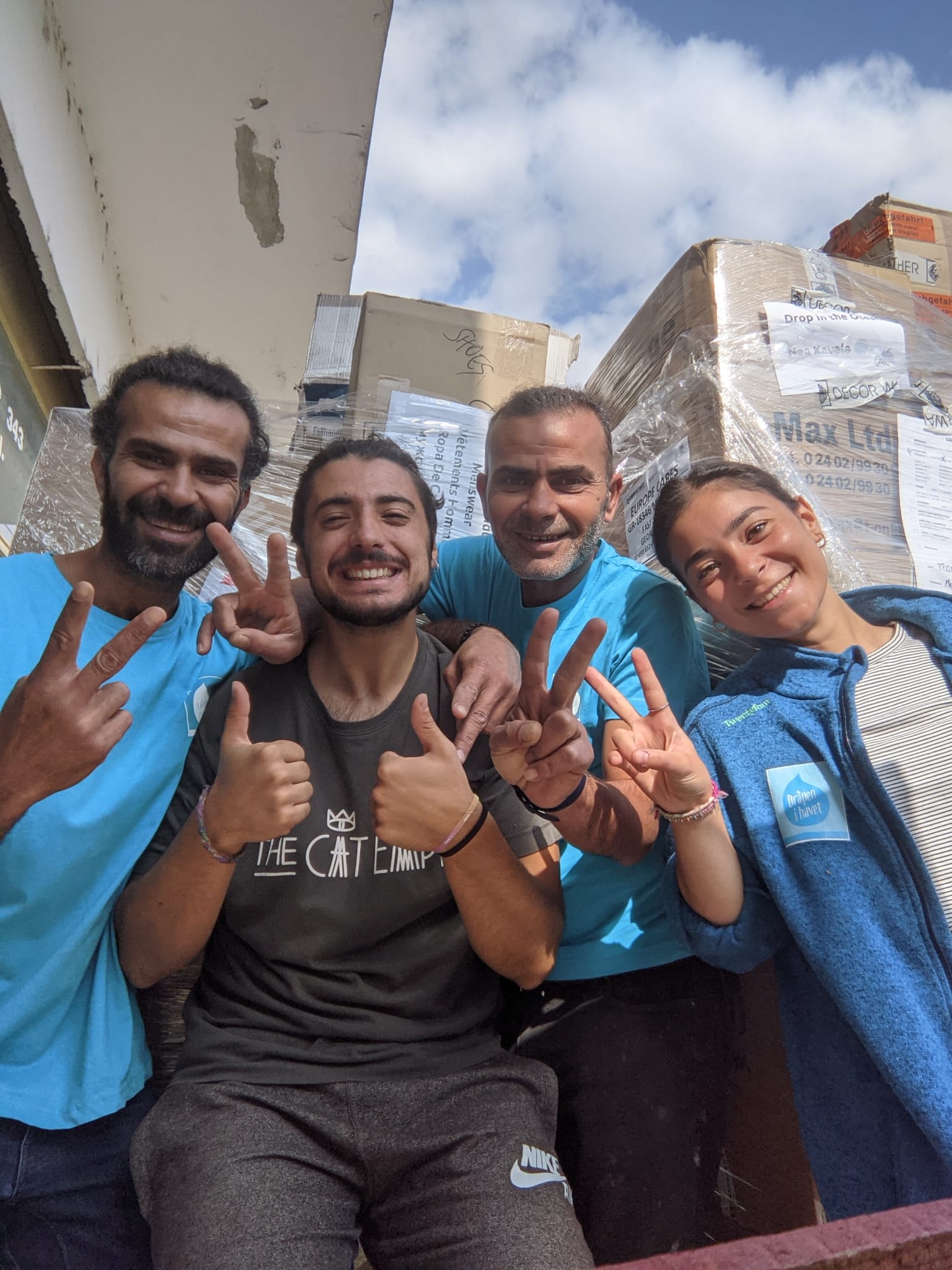 volunteers huddled together, posing for a photo