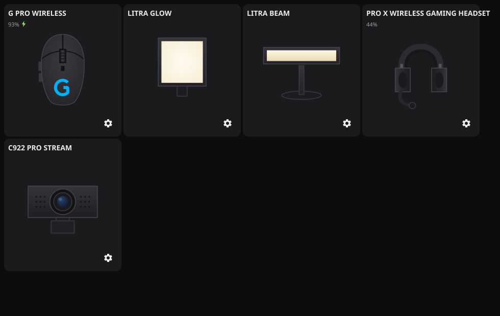 LogiTux's Dashboard, styled after Logitech G HUB: one dark card per connected device with a product render (original artwork, not Logitech's — see Credit), battery level, and a settings button