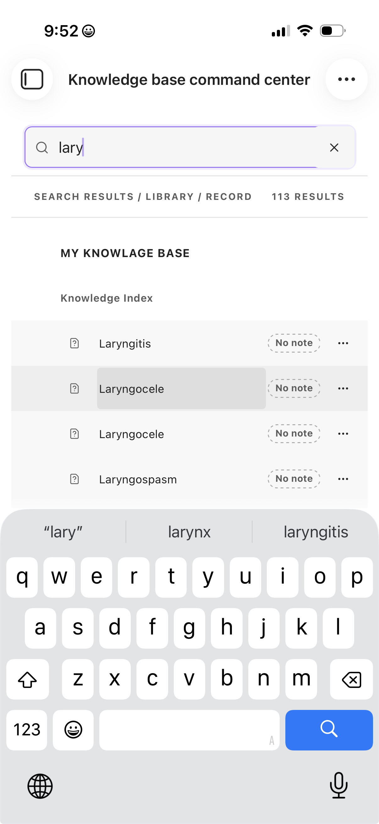 Knowledge Base Command Center search results above the iPhone keyboard