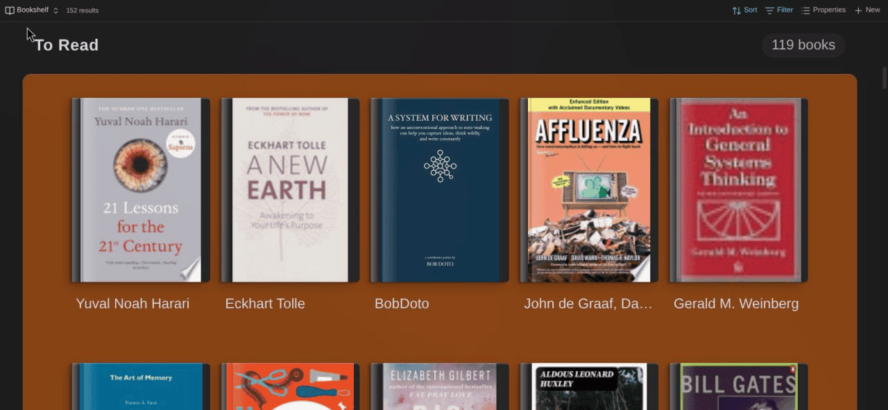 Bookshelf view showing book covers on a wooden shelf