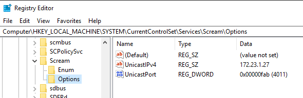 The registry keys are under Computer\HKEY_LOCAL_MACHINE\SYSTEM\CurrentControlSet\Services\Scream\Options and they're called UnicastIPv4 for the IP in REG_SZ format and UnicastPort for the port, in REG_DWORD format.