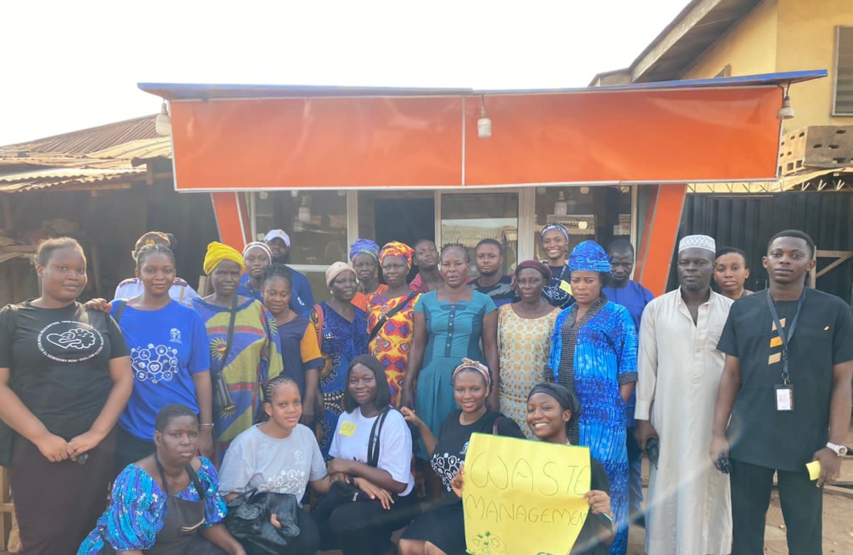 Group photo after cleanup at Ketu market