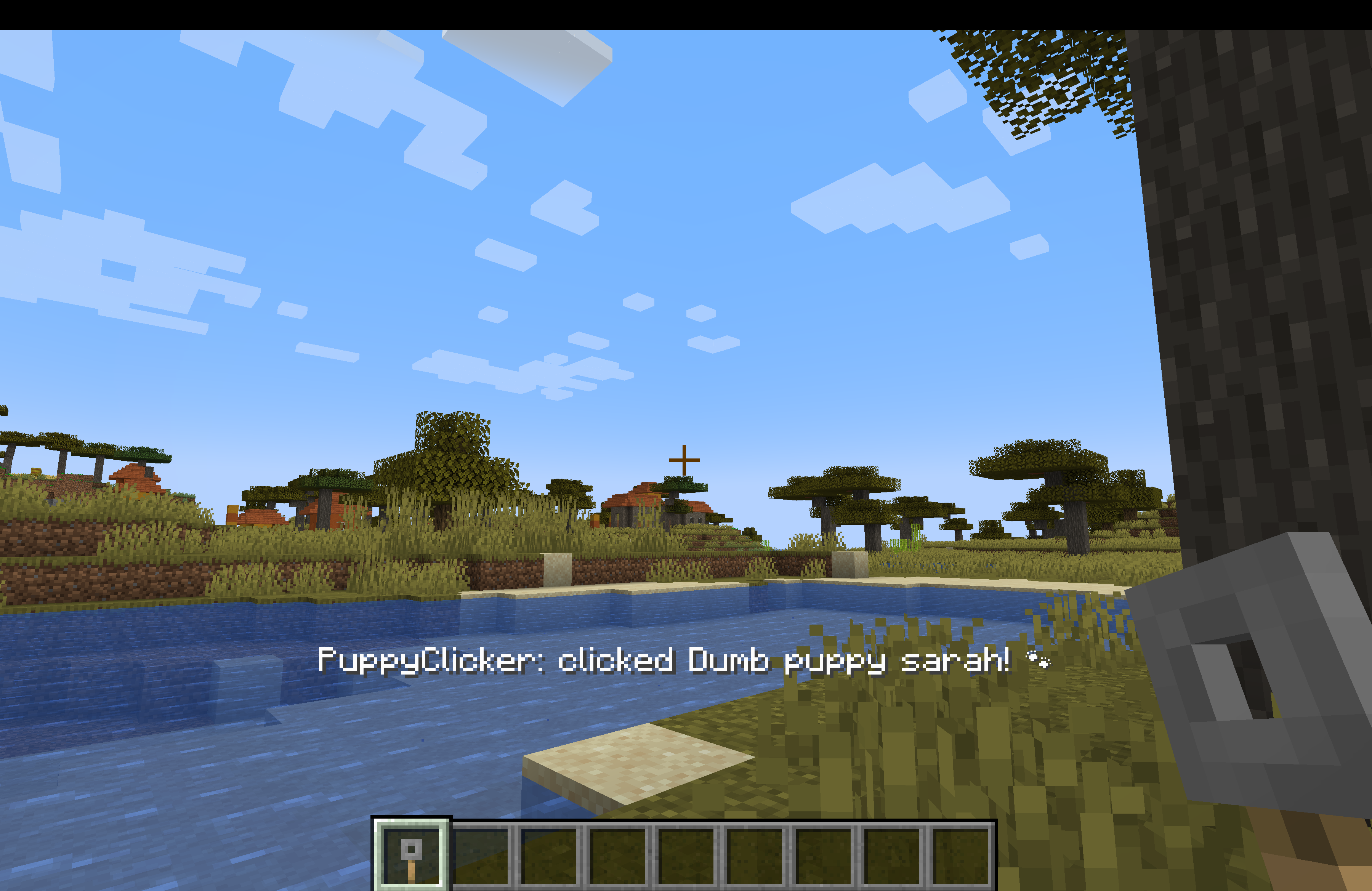 Minecraft gameplay showing a Puppy Clicker held in hand and successful friend-click feedback above the hotbar