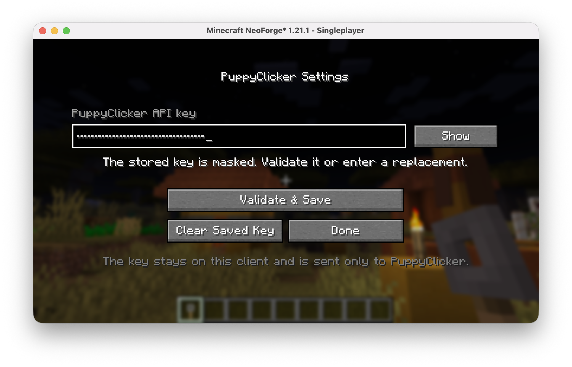 PuppyClicker settings screen showing a masked stored API key, Show button and validation controls