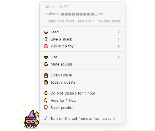 Right-clicking the cat opens a menu with its fullness and energy, today's writing, feeding, snacks, toys, quiet mode and more, each with its own pixel icon.